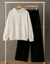 Plain white hoodie with black wide leg jeans